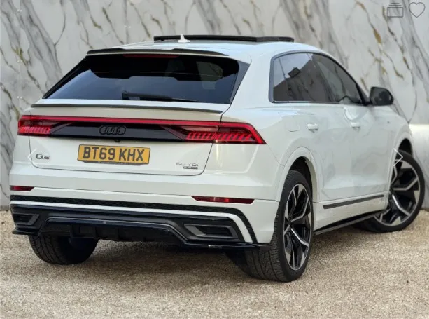 Audi Q8 in Glacier White — premium car valuation