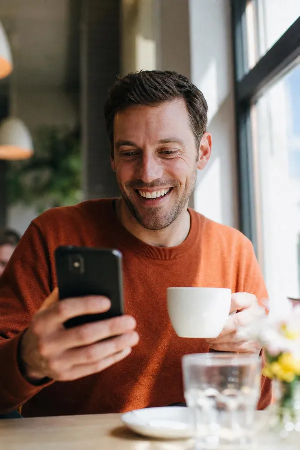 Seller reviewing competing buyer offers on a phone